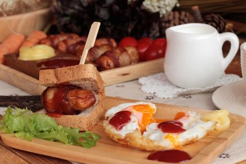 Grilled sausages wrapped in bacon fat of delicious.