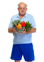 Senior man with vegetables.