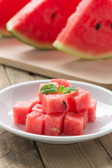 Cubes watermelon on white plate.