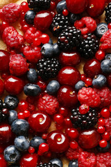 Sweet tart with raspberries, blueberries, blackberries, cherries