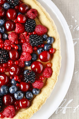 Sweet tart with raspberries, blueberries, blackberries, cherries