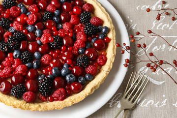 Sweet tart with raspberries, blueberries, blackberries, cherries