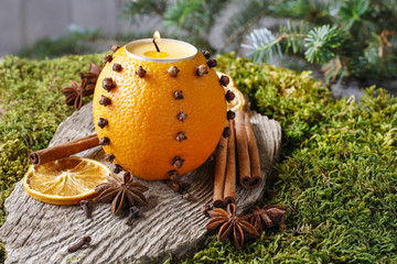 Orange pomander ball with candle