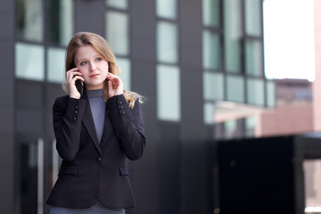 young businesswoman talking to mobile