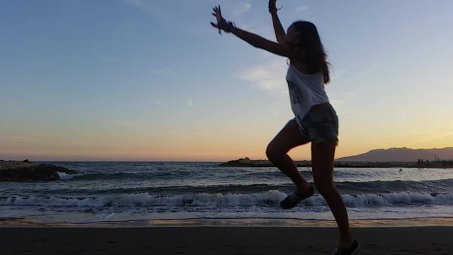 
girl jumping at sunset