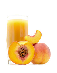 peach juice in a glass with a peach and cut sliced the peach near isolated on white background