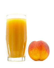 peach juice in a glass with a peach near isolated on white background