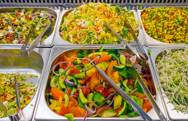 Colorful salads at a buffet in a restaurant