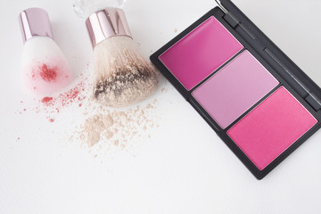 top view of pink tone colour blusher with two size brush