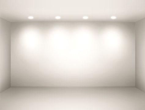 Empty space - empty wall in a room with light spots. © pabijan