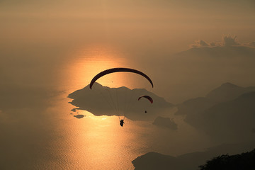 Sunset and Paragliding © sahinaybey
