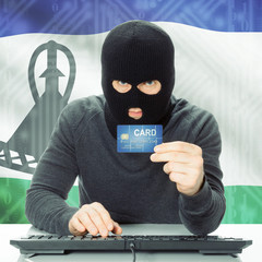 Concept of cybercrime with national flag on background - Lesotho