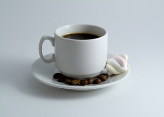 cup of coffee with marshmallows isolated on white background
