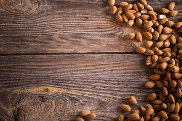 Almonds on wooden background