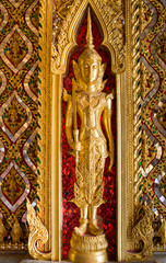 The golden deva with the sword in hand