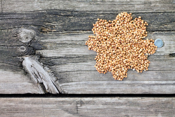Buckwheat on a dark wooden background, top view