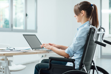 Young disabled businesswoman at work