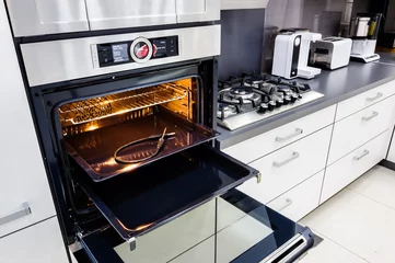 Foto op Plexiglas Modern hi-tek kitchen, oven with open door © starush