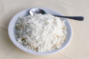 Cooked pasta with grated feta cheese