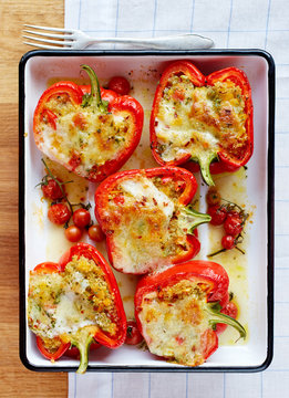 Roasted peppers stuffed with quinoa, vegetables and cheese.