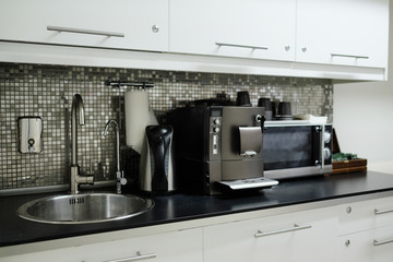 Interior of the bar: coffee maker, kettle, microwave