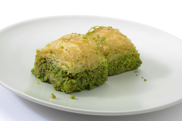 Traditional Turkish dessert called baklava in white plate