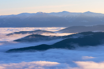 Naklejka na ściany i meble Morning landscape in the mountains with fog