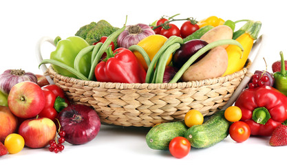 Heap of fresh fruits and vegetables  in basket close up