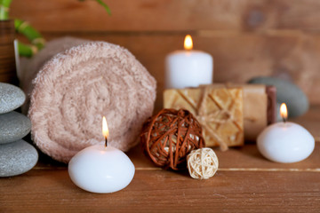 Obraz na płótnie Canvas Beautiful spa composition with candles on wooden background