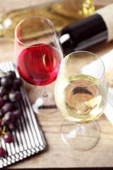 Still life of wine and bread on rustic wooden background