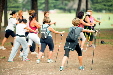 group of women making exercise before walking