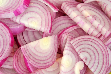 Slised red onion, close up, as background  DOF