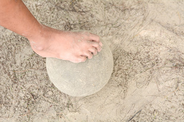 Human foot stepped on the balll