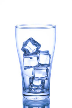 Empty glass with ice cube