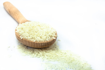 Rice in the Wooden Spoon on Isolated White Background