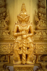 Fototapeta na wymiar gold giant statue