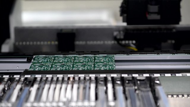 Close-up of automated electronics parts manufacturing