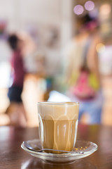 hot latte coffee on wooden table, vintage and retro style