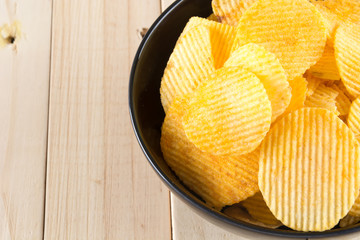 potato chips on wood background