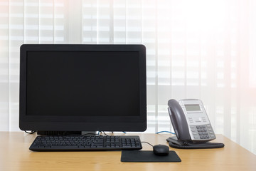 telephone and computer on table work of room service office