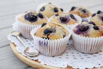 Homemade wholemeal coconut blueberry muffins with silver spoon