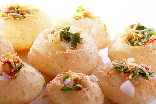 Panipuri stuffed with masala and it is floating over flavored water
