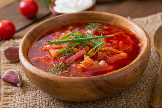 Traditional Ukrainian Russian vegetable borscht soup on the old wooden background