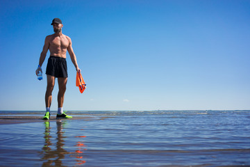 The man on the lake after running drinking water