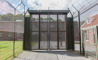 Naklejka na ściany i meble Large gate at an old jail