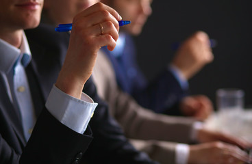 Image of business partners discussing documents and ideas at