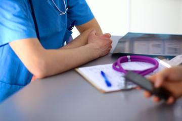 close up of patient and doctor taking notes
