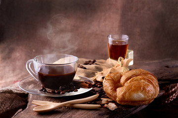 breakfast hot coffee  with honey and croissant