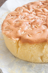 Homemade butter cake with almond stick on top