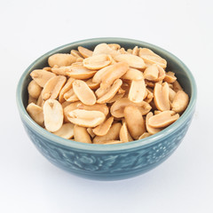 Salted peanuts blue ceramic bowl on White paper Background